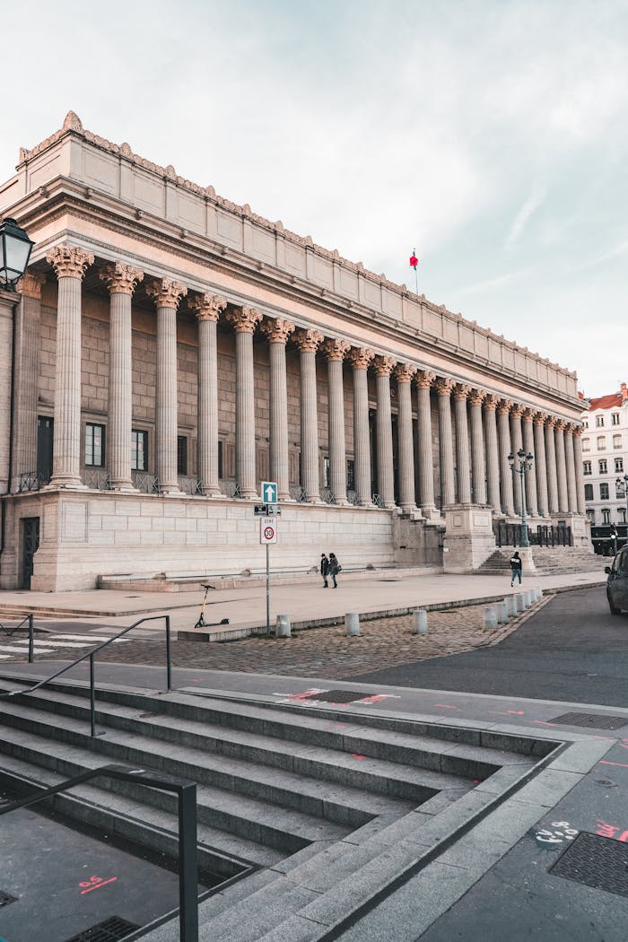 Majestic neo-classical courthouse in Lyon, France with grand columns and historic charm.